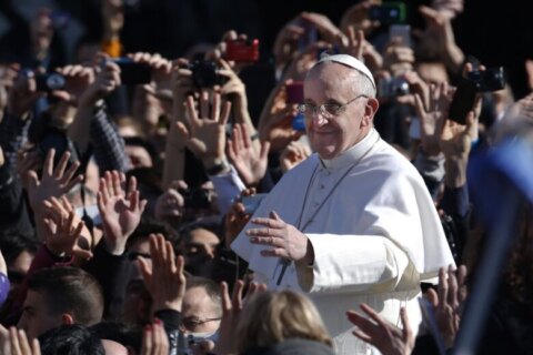 Pope Francis waves as he arrives in St. Peter's Square for his inauguration Mass at the Vatican, Tuesday, March 19, 2013.
