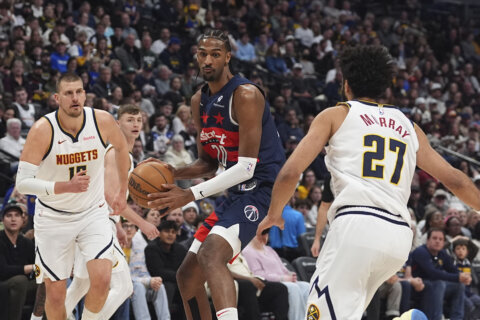 Poole’s 3-pointer with 2.1 seconds left gives Wizards a 126-123 win over the Nuggets