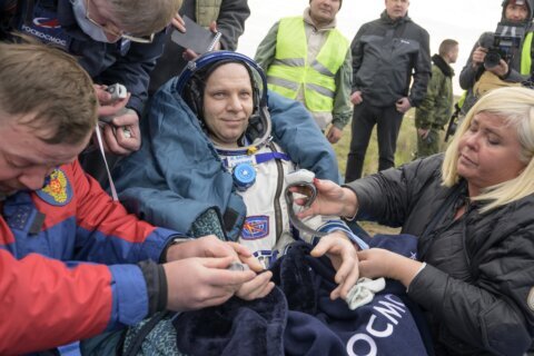A Soyuz capsule with 2 Russians and 1 American returns to Earth from the International Space Station