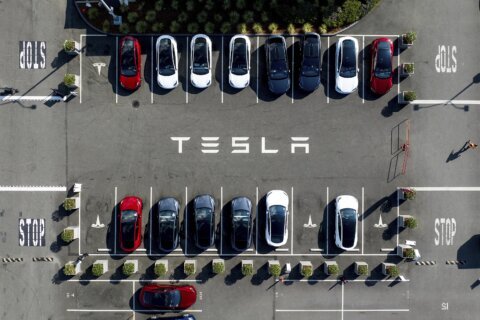 Musk says he’ll spend less time in Washington and more time running Tesla after its profit plunges